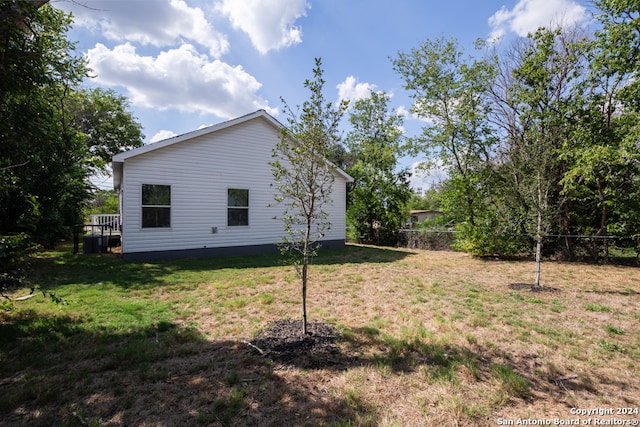 view of property exterior featuring a lawn