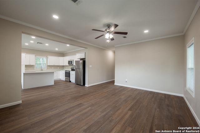 unfurnished living room featuring ceiling fan, dark hardwood / wood-style floors, and crown molding