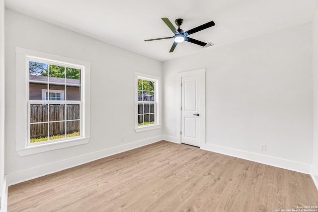 unfurnished room with ceiling fan and light hardwood / wood-style flooring