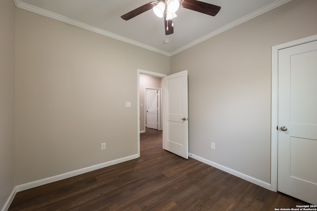 unfurnished bedroom featuring ceiling fan, crown molding, and dark hardwood / wood-style flooring