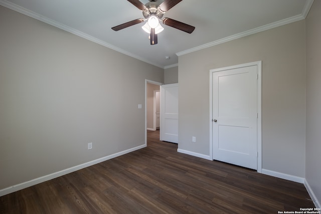 unfurnished bedroom featuring ceiling fan, dark hardwood / wood-style floors, and ornamental molding