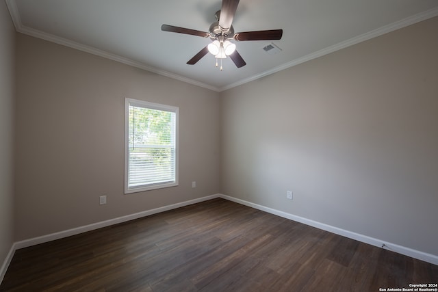 unfurnished room with ceiling fan, dark wood-type flooring, and crown molding