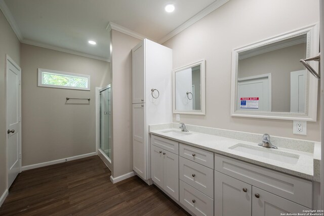 219 Gray St, San Antonio, TX 78208 - bathroom with wood finished floors, ornamental molding, and a sink