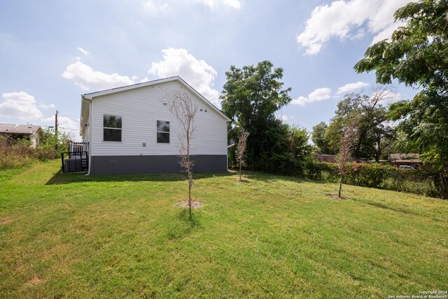 219 Gray St, San Antonio, TX 78208 - view of side of home featuring crawl space and a yard