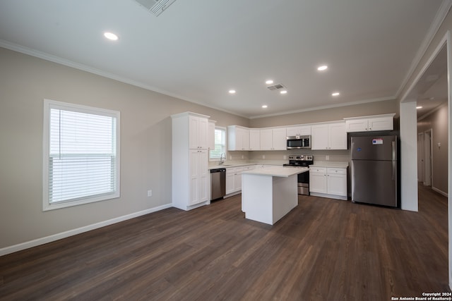 kitchen with white cabinetry, appliances with stainless steel finishes, and dark hardwood / wood-style floors