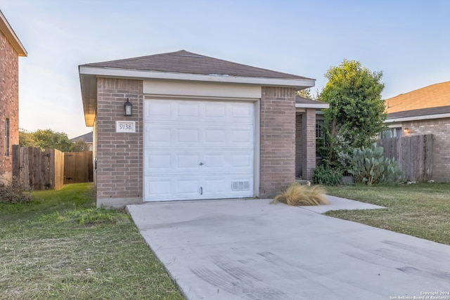 garage with a yard