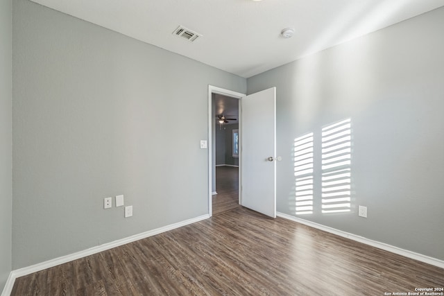 empty room featuring dark hardwood / wood-style floors