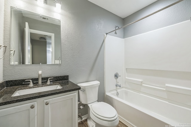 full bathroom featuring vanity, toilet, and bathtub / shower combination