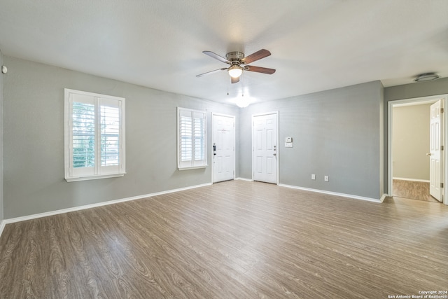 spare room featuring ceiling fan and hardwood / wood-style floors