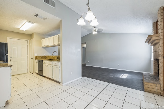 kitchen with vaulted ceiling, light wood-type flooring, black appliances, ceiling fan, and sink