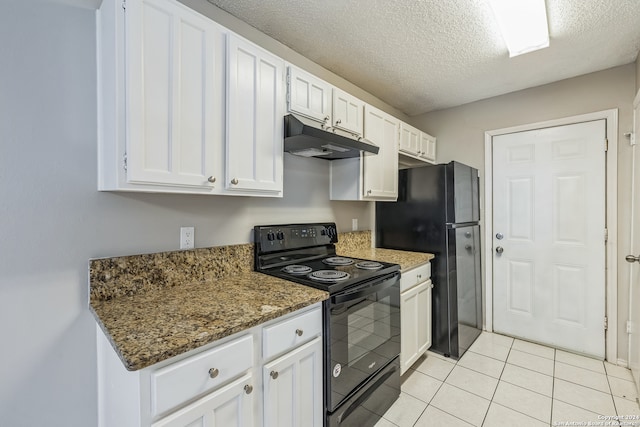 kitchen with light tile patterned floors, a textured ceiling, white cabinetry, black appliances, and dark stone countertops