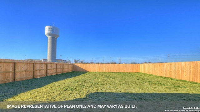 view of yard with a fenced backyard