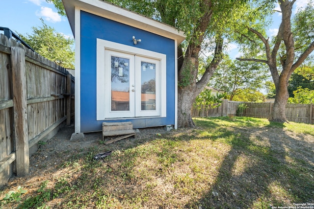 view of outbuilding with a yard