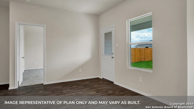 empty room featuring dark wood-type flooring