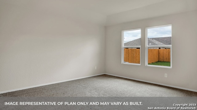 spare room featuring carpet floors