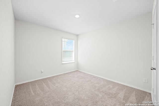 empty room featuring carpet floors