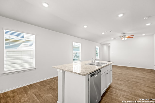 kitchen featuring white cabinets, sink, a healthy amount of sunlight, and stainless steel dishwasher