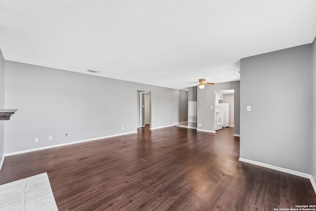 unfurnished living room featuring a textured ceiling, dark hardwood / wood-style flooring, and ceiling fan