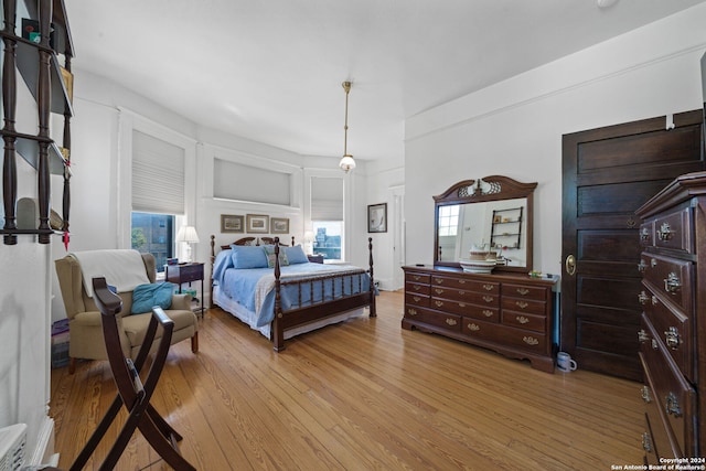 bedroom featuring light wood-type flooring and multiple windows