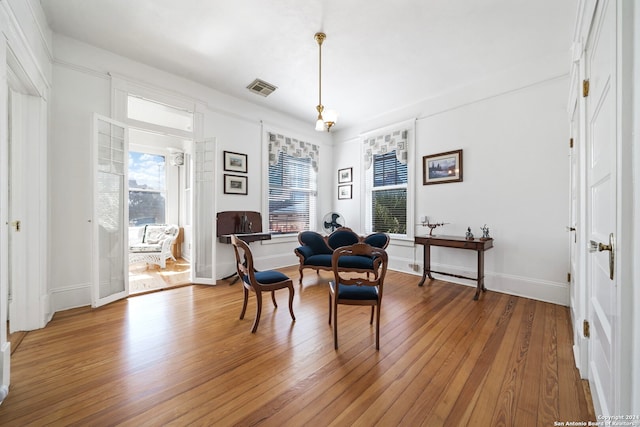 sitting room with hardwood / wood-style flooring