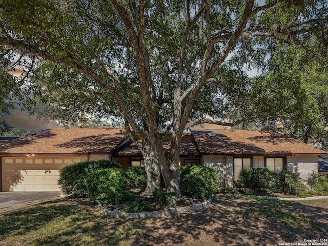 ranch-style home featuring a garage