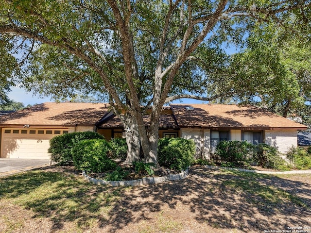 single story home featuring a garage