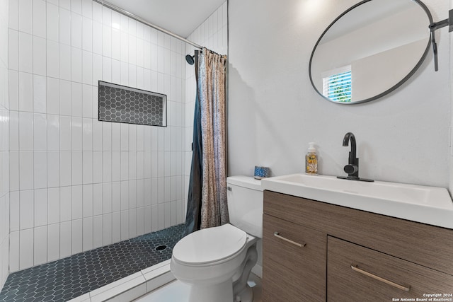 bathroom featuring a shower with curtain, vanity, and toilet