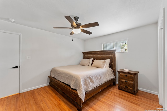 bedroom featuring light hardwood / wood-style floors and ceiling fan