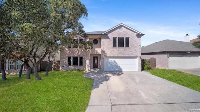 view of front property featuring a front yard and a garage