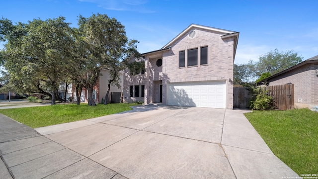 front of property featuring a front lawn and a garage