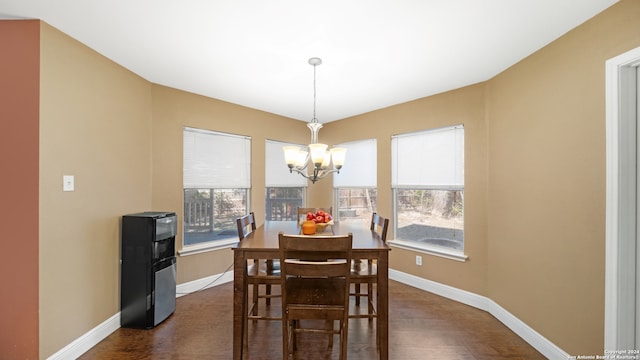 dining space with a notable chandelier and a healthy amount of sunlight