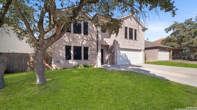 view of front of home with a garage and a front lawn