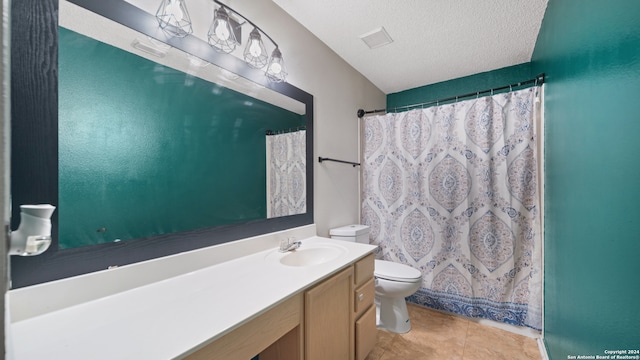 bathroom with vanity, toilet, a textured ceiling, a shower with curtain, and tile patterned flooring