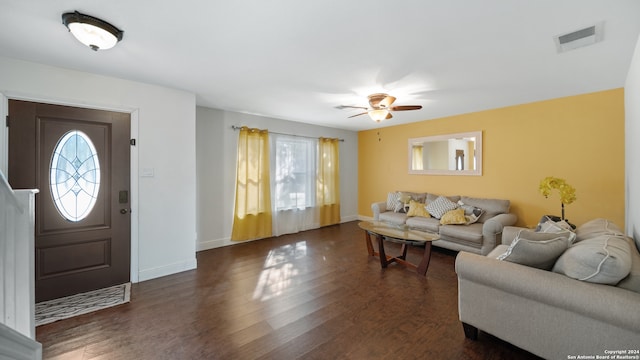 living room with ceiling fan and dark hardwood / wood-style floors