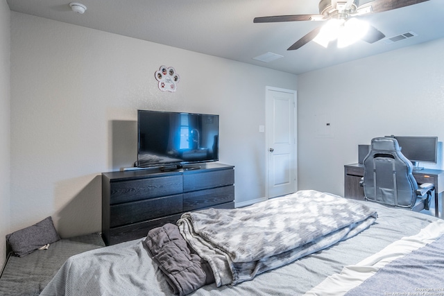 bedroom with ceiling fan and light carpet