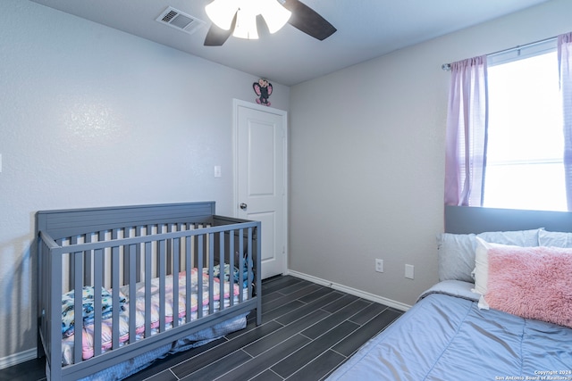 bedroom featuring ceiling fan and dark hardwood / wood-style flooring