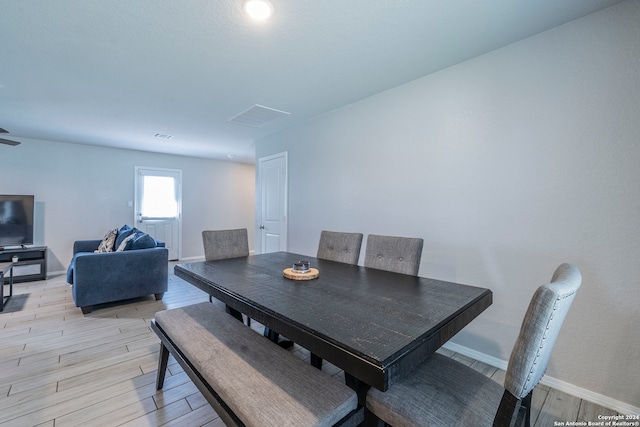 dining area with light hardwood / wood-style floors