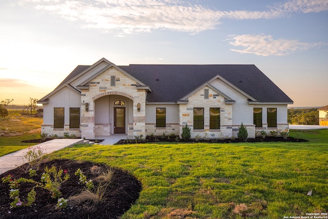 view of front of property with a yard