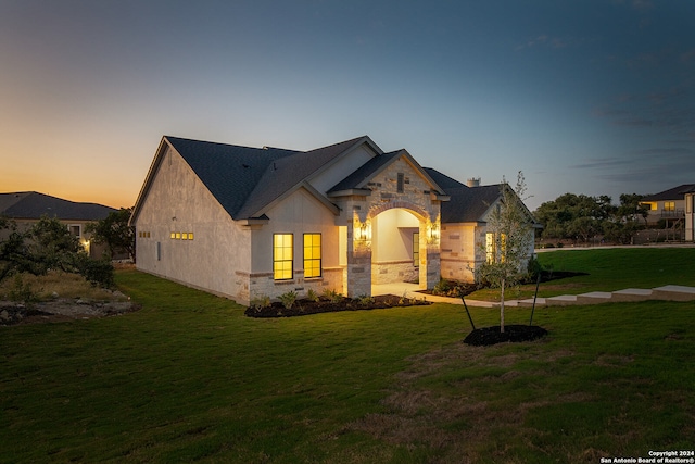 view of front of property with a yard