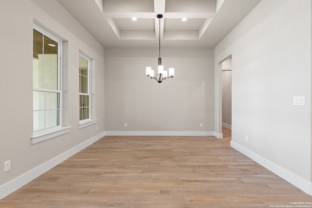 unfurnished dining area featuring light hardwood / wood-style floors and plenty of natural light