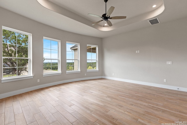 empty room with light wood-type flooring and a healthy amount of sunlight