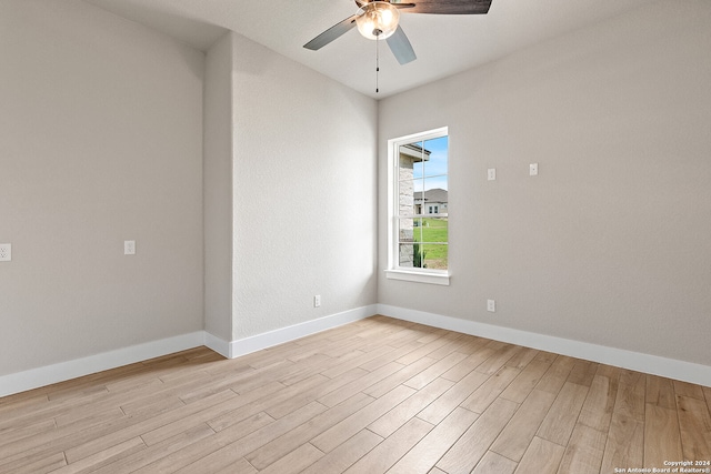 spare room featuring ceiling fan and light hardwood / wood-style floors