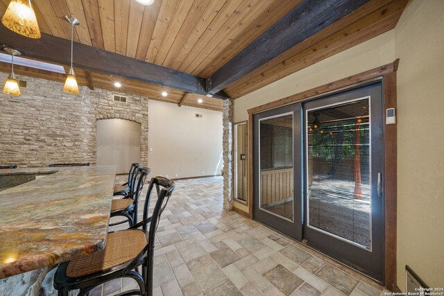 interior space with wooden ceiling and beam ceiling