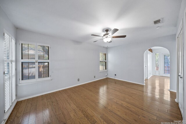 spare room with ceiling fan and hardwood / wood-style floors