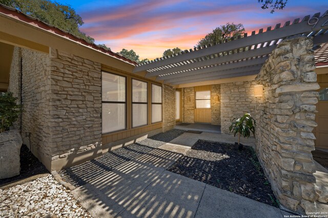 view of patio terrace at dusk