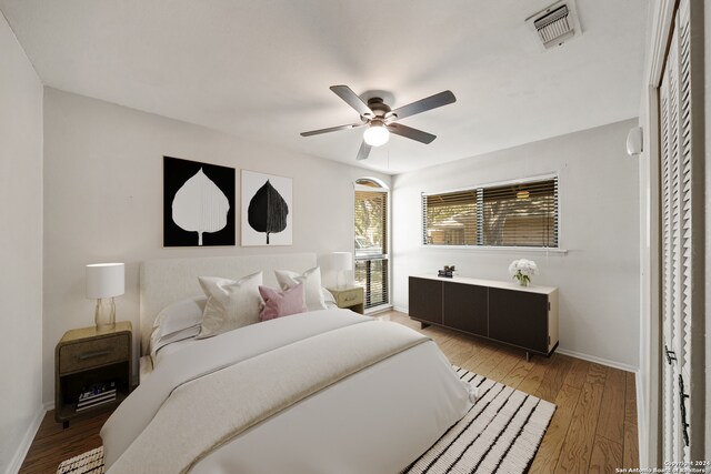 bedroom featuring hardwood / wood-style floors and ceiling fan