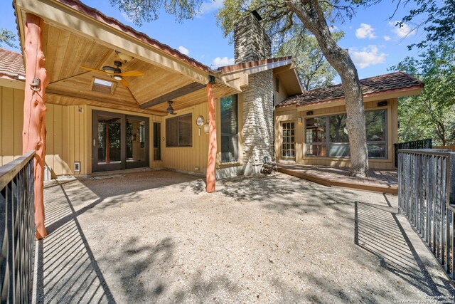 rear view of house featuring a patio, ceiling fan, and a wooden deck