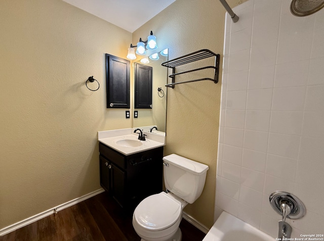 full bathroom featuring wood-type flooring, vanity, toilet, and shower / washtub combination