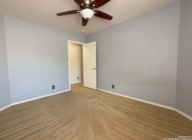 carpeted empty room with ceiling fan