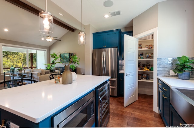 kitchen with vaulted ceiling with beams, a kitchen island, beverage cooler, appliances with stainless steel finishes, and dark hardwood / wood-style flooring